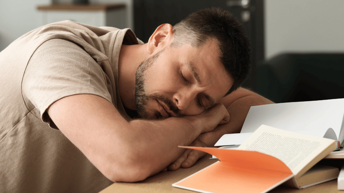 A man affected by sleep deprivation and performance decline during daily tasks.